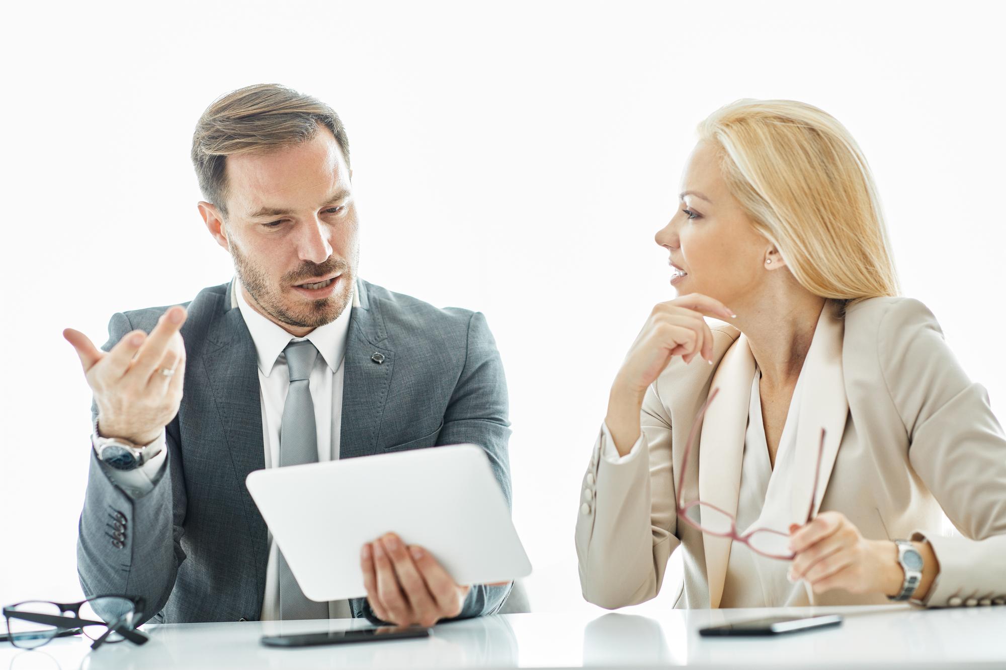 Consultation scene with two people discussing finances